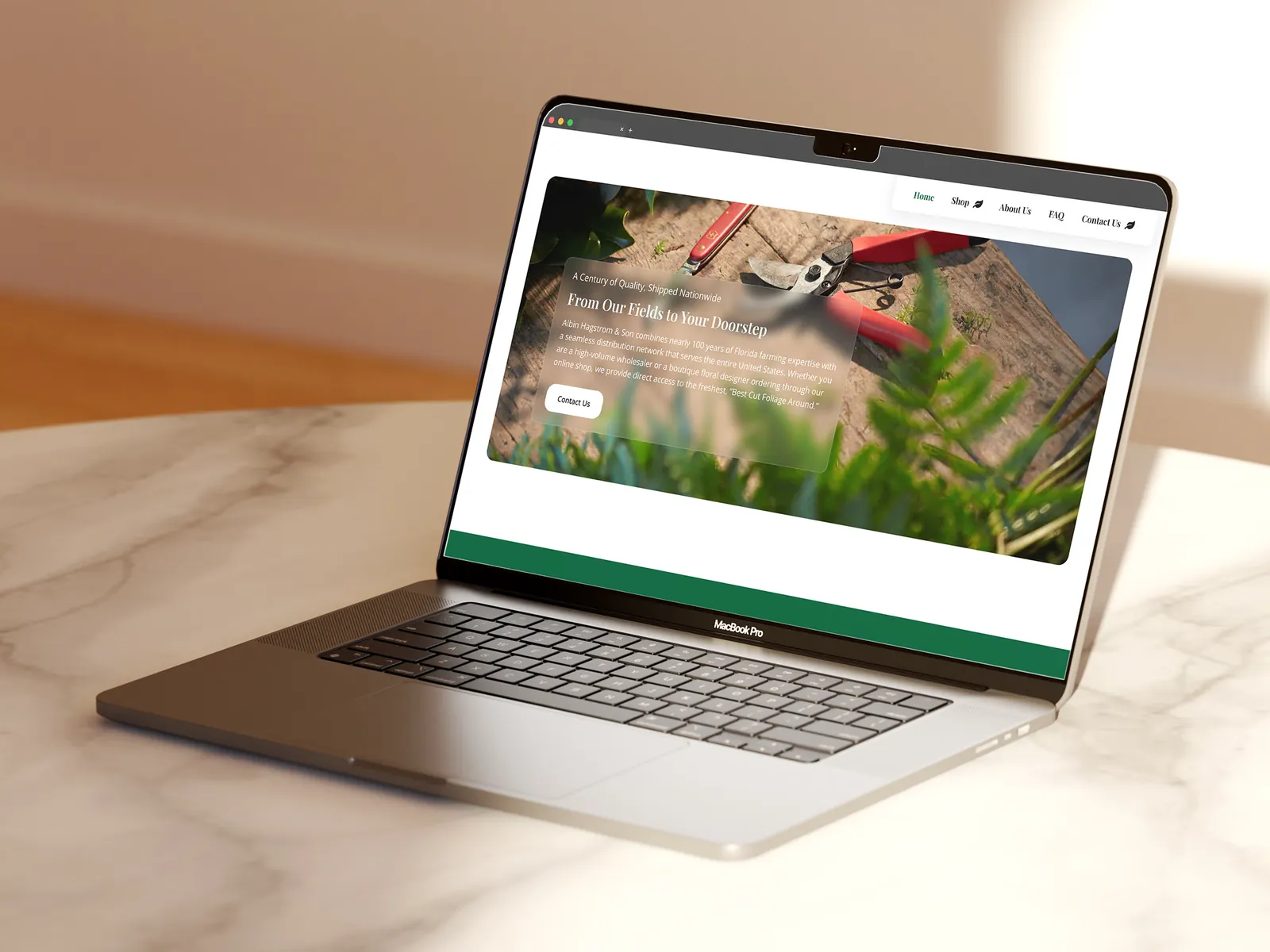 Albin Hagström & Son's homepage on a laptop on a marble table: From Our Fields to Your Doorstep
