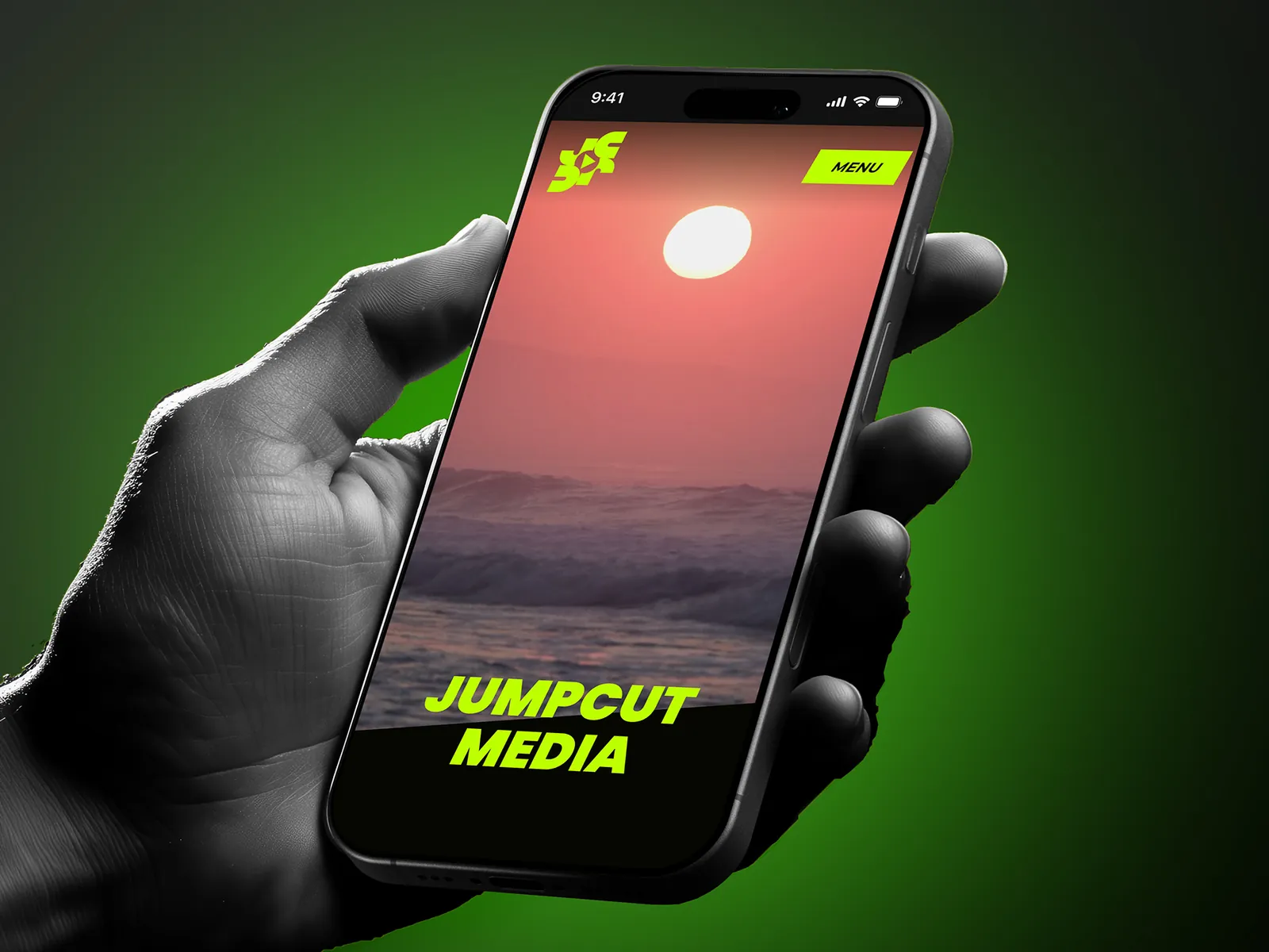Jumpcut Media's homepage on a phone: a sunset over the sea, full screen, under the name
