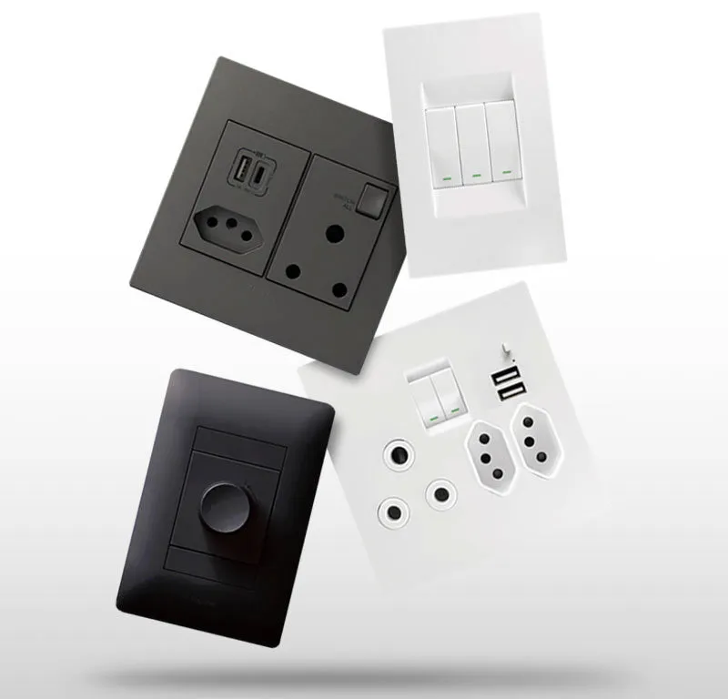 Light switches and plug sockets with USB ports in black and white