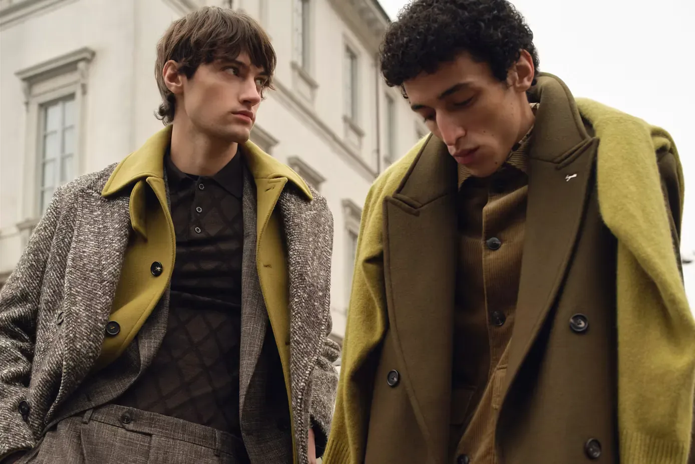 Two men in Bugatti wool coats outside a townhouse