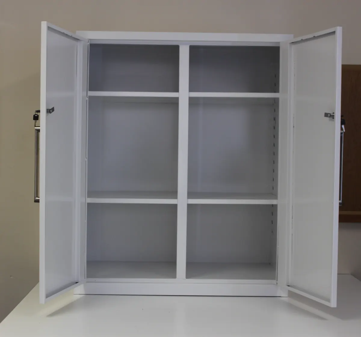 A two-door steel cabinet with shelves, doors open
